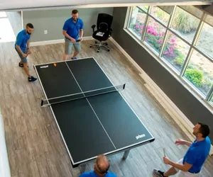 Hayes Company workers playing ping-pong.