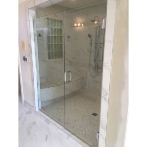 Frameless hinged glass shower doors.