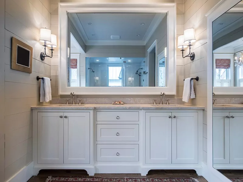 Custom mirror above a bathroom vanity.