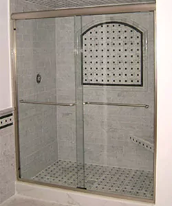 Sliding glass shower door.