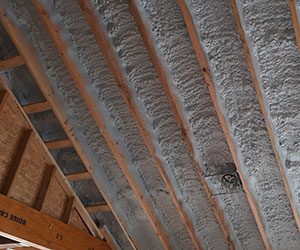 Spray foam insulation in a vaulted ceiling.