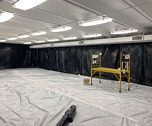 Spray foam insulation in a warehouse.