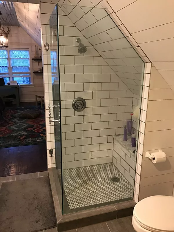 Semi walk-in shower in upstairs bathroom.