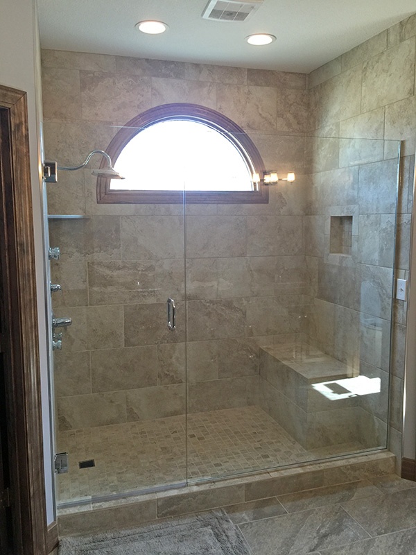 Large new shower with semi circled window.