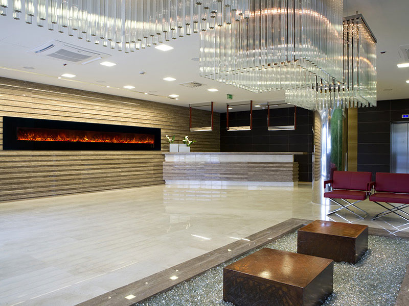 Large electric fireplace in a hotel lobby