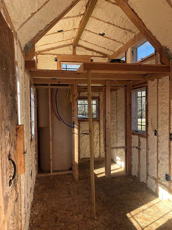 Interior of a tiny home after insulation.