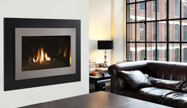 Modern gas fireplace in a living room with a large window.