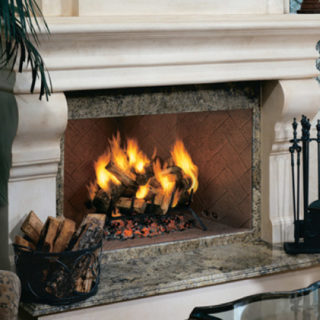 Lit wood burning fireplace with heavy molding