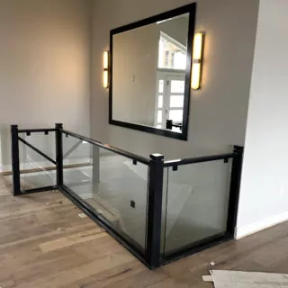 Custom wall mirror and glass stair wall