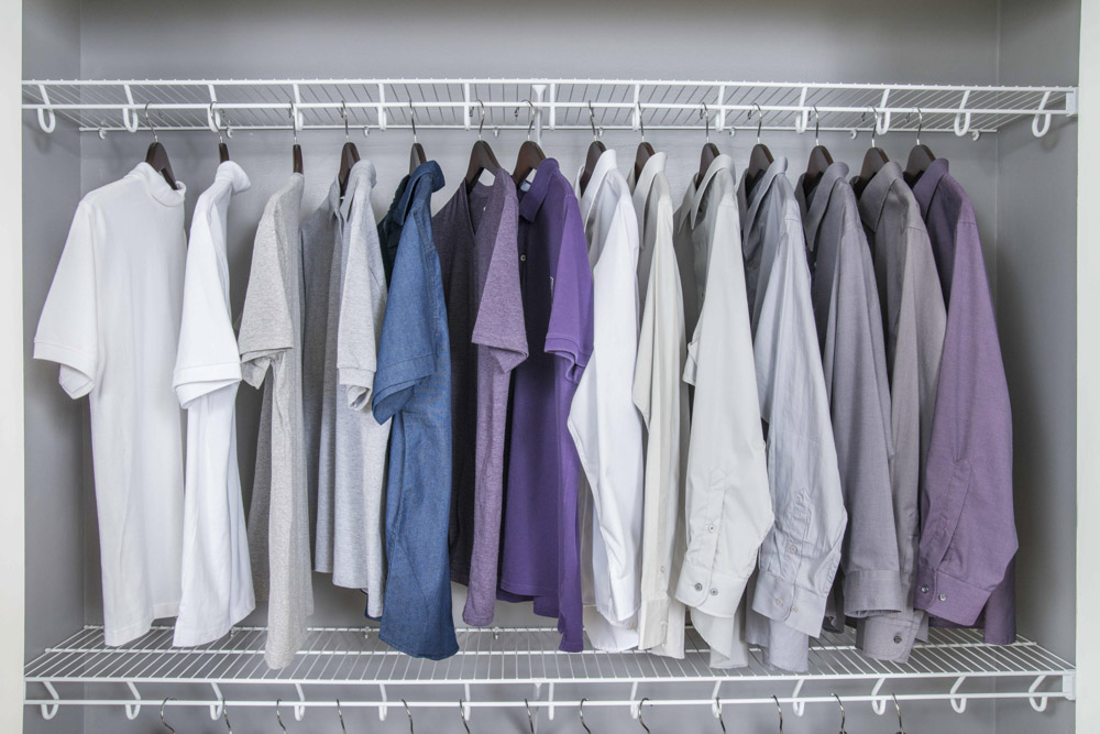 Mens shirts hanging in an organized closed