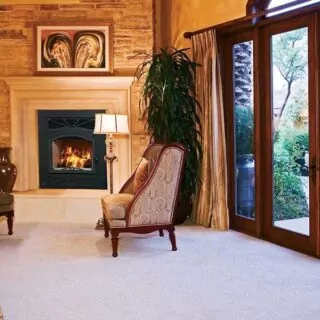Wood burning fireplace in a home's den area.