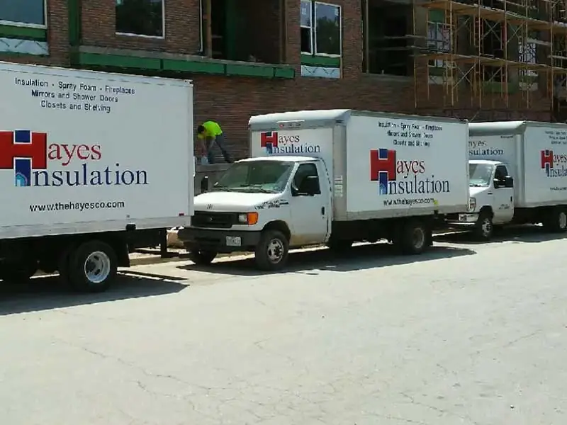 Hayes Insulation trucks outside of jobsite