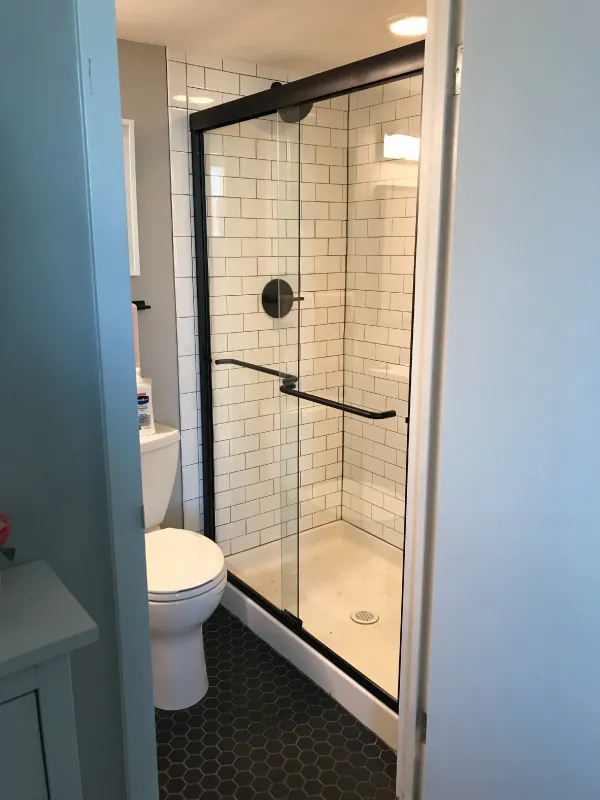 Sliding shower door in a small bathroom