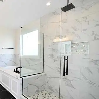 Enhance your bathroom’s aesthetics with a frameless glass shower door, providing a fresh and modern look.