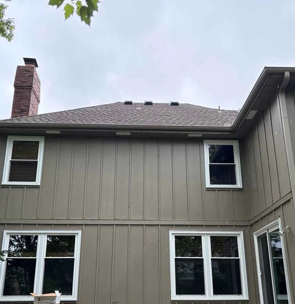 New soffit vents installed on Kansas City home exterior – Hayes Company attic air sealing project.