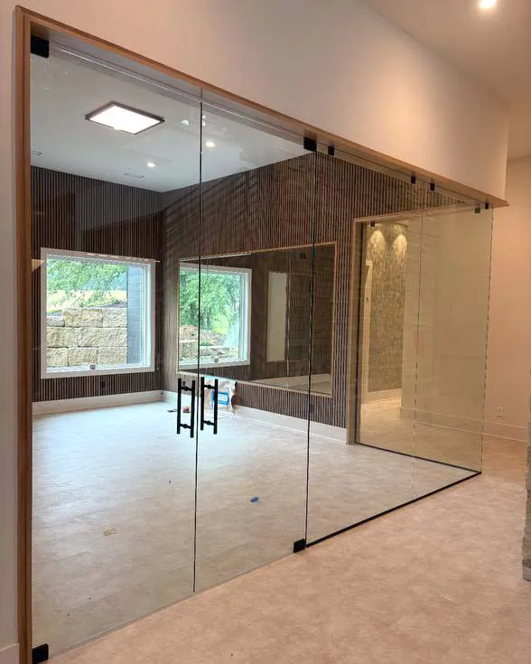 Custom glass wall in home gym.