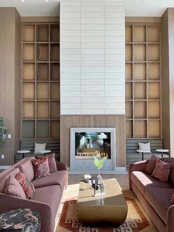 Hayes Company Montigo Prodigy II gas fireplace in a commercial lounge with built-in shelving at Berkley Riverfront in Kansas City, MO.