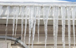 Frozen gutters with ice dam.