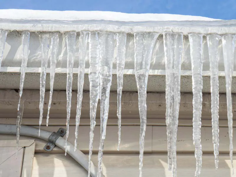 Frozen gutters with ice dam.